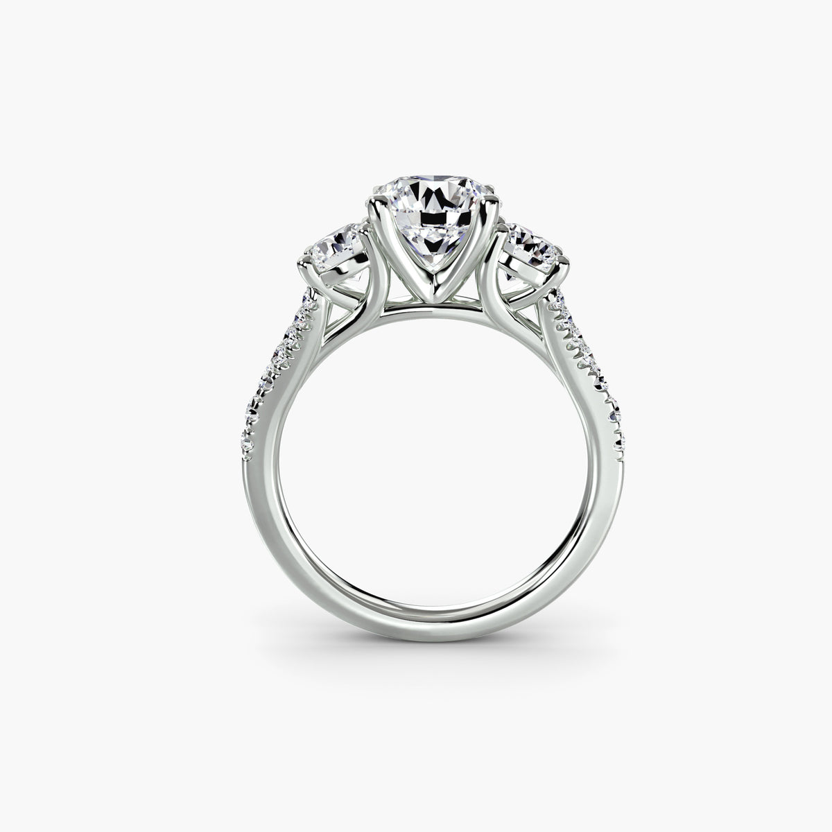 Profile view of delicate pavé three-stone engagement ring – The Violette
