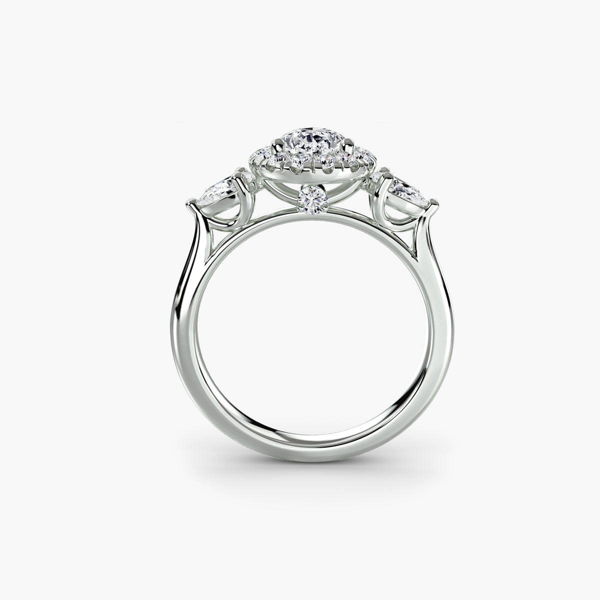Profile view of The Clarimond three-stone halo engagement ring with pear-shaped side diamonds