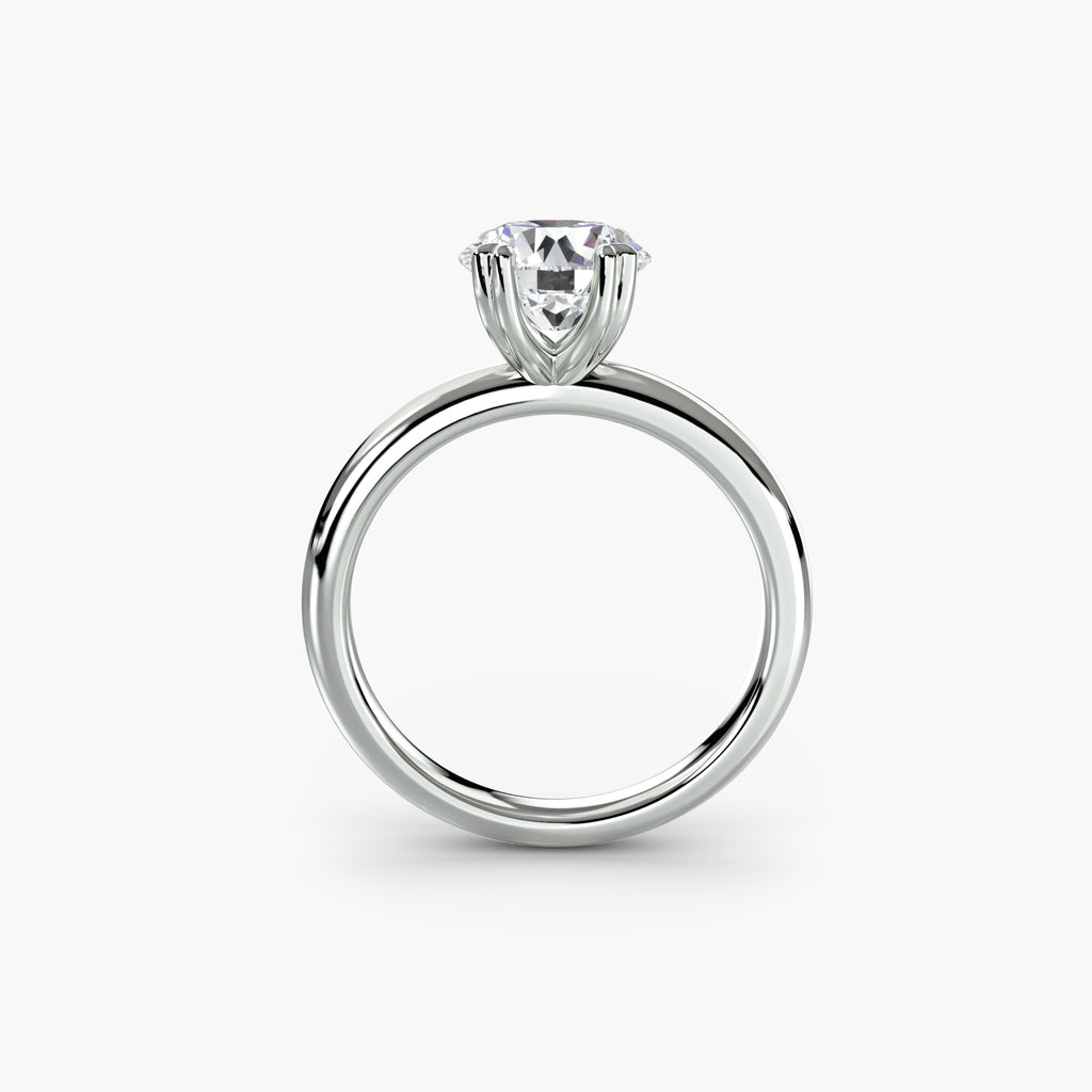 Profile view of The Juliette solitaire engagement ring with open basket setting