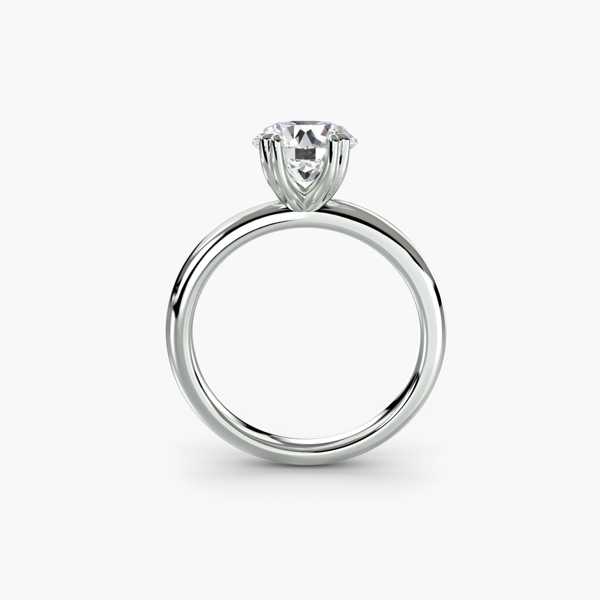 Profile view of The Juliette solitaire engagement ring with open basket setting