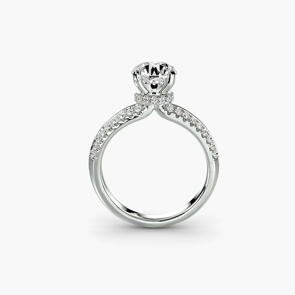 Profile view of The Séraphine hidden halo engagement ring with pavé diamond band