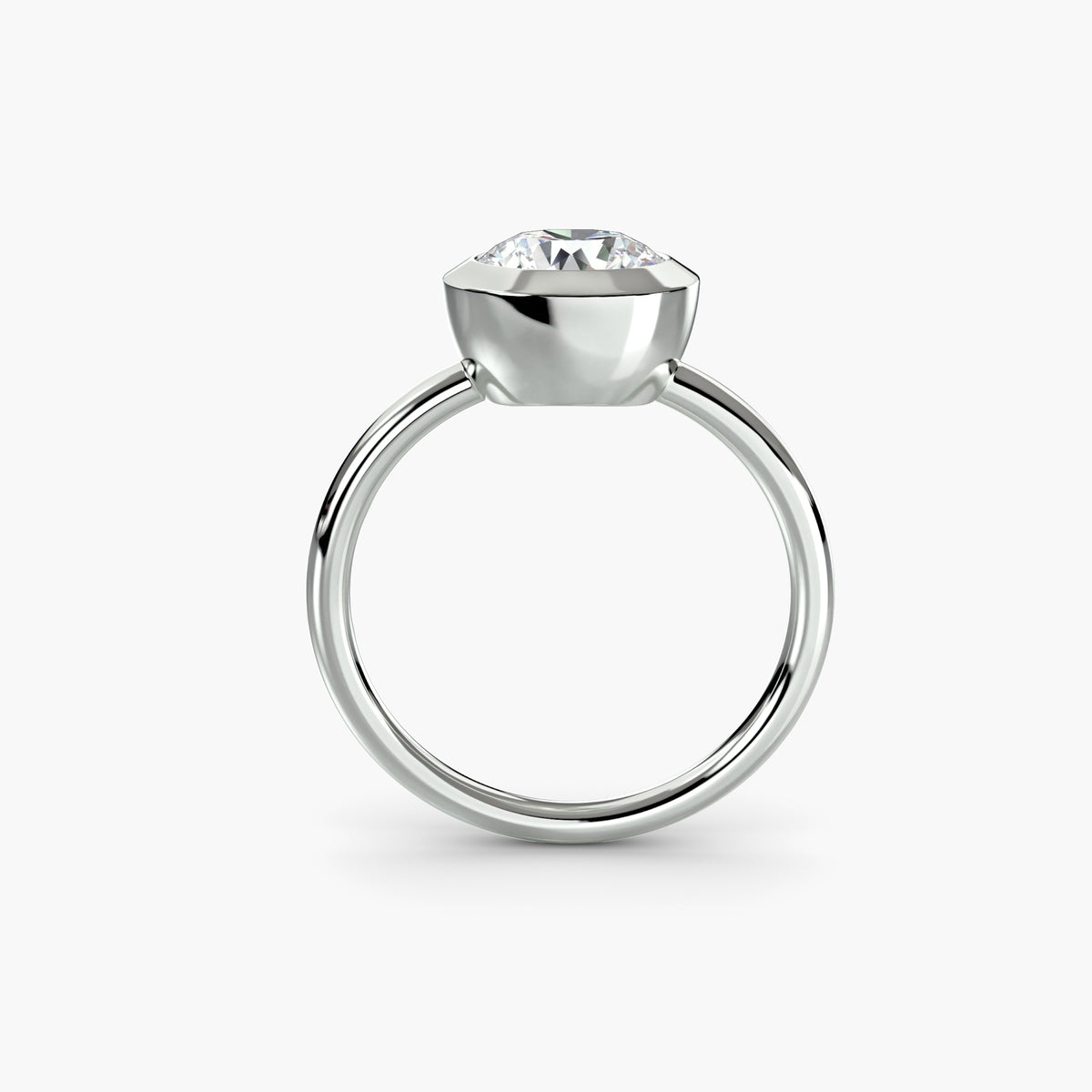 Profile view of The Vivienne bezel-set solitaire engagement ring