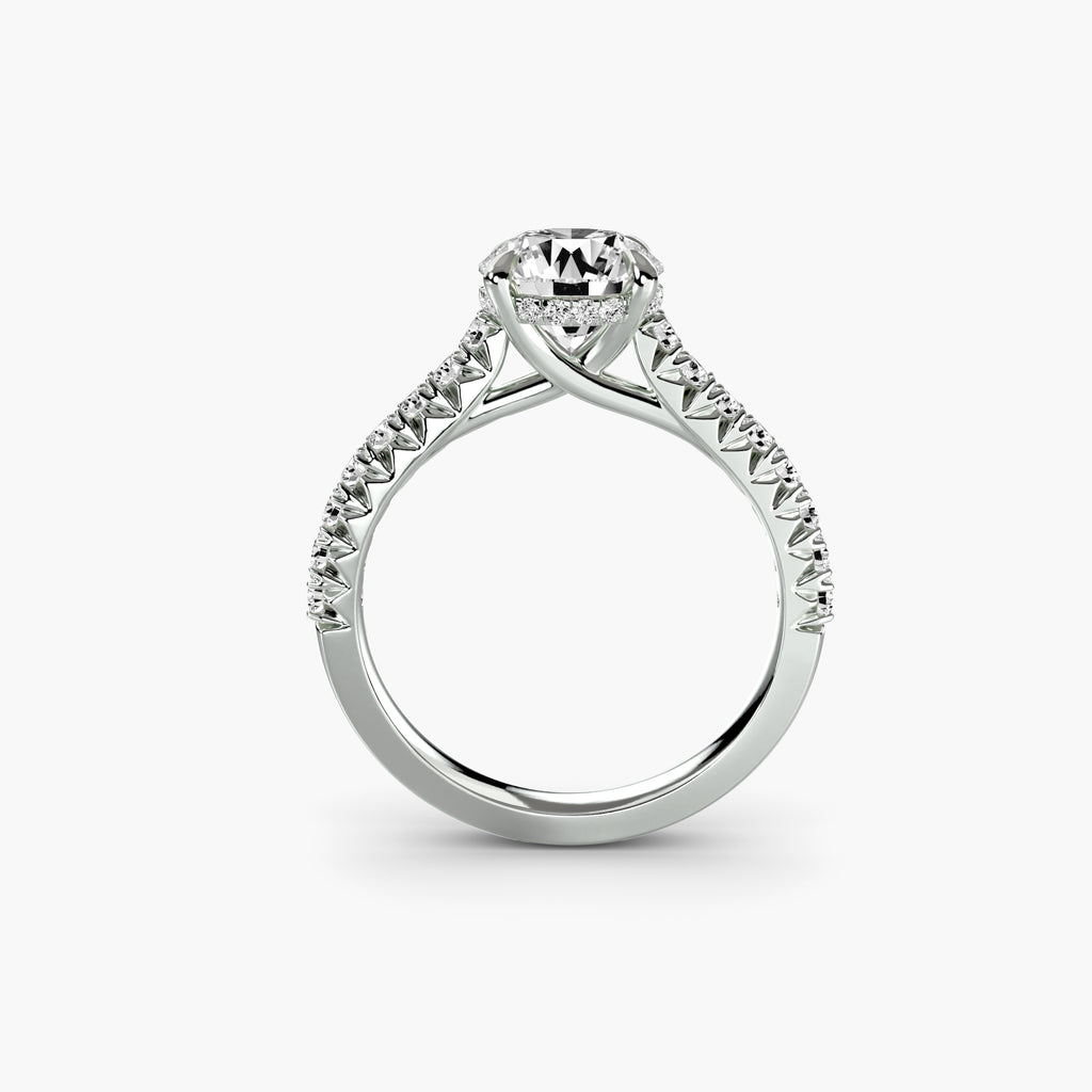 Profile view of The Isabelle cathedral pavé engagement ring with raised shoulders