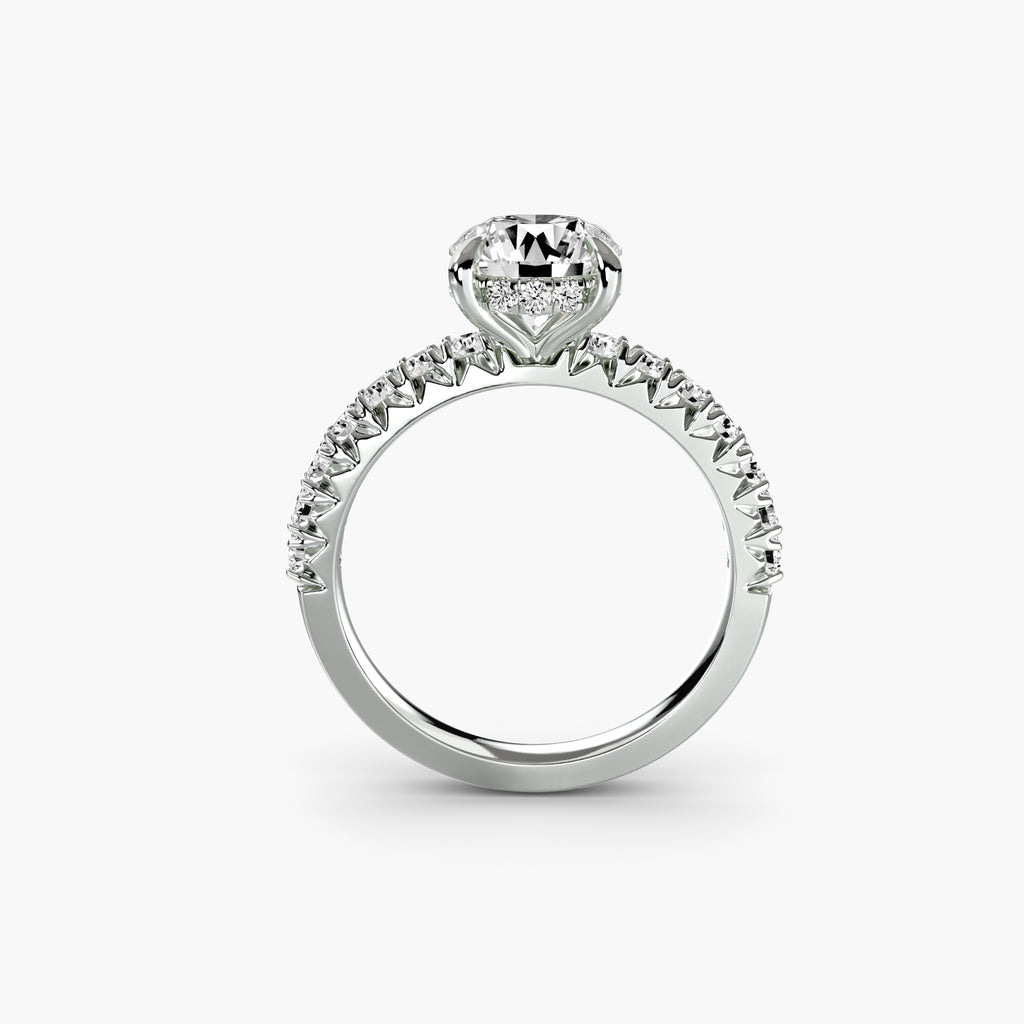 Profile view of The Éliane hidden halo engagement ring with pavé diamond band