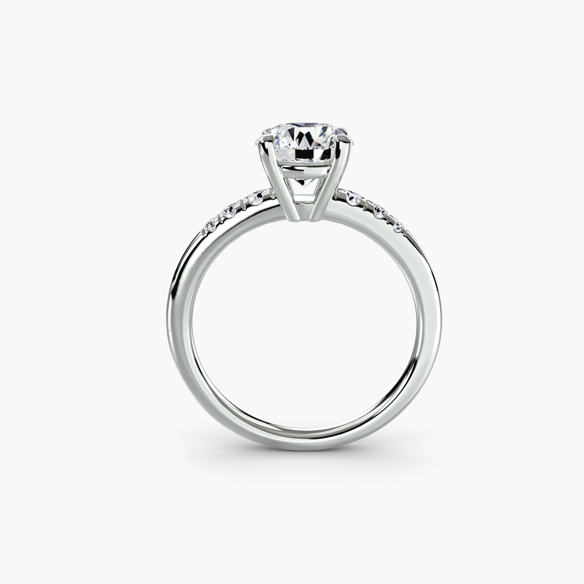 Profile view of The Camille pavé solitaire engagement ring with diamond-accented shoulders