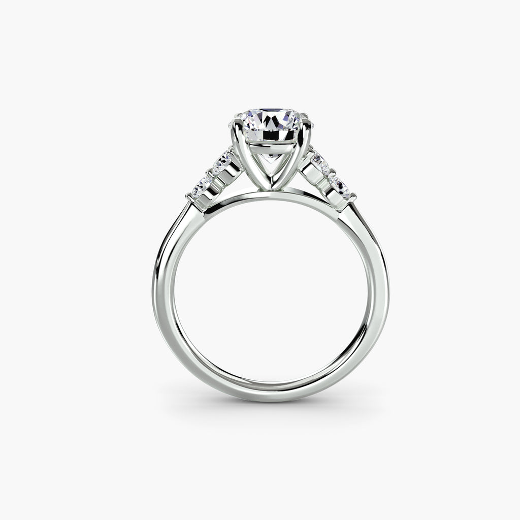 Profile view of The Sabine solitaire engagement ring with graduated diamond side stones