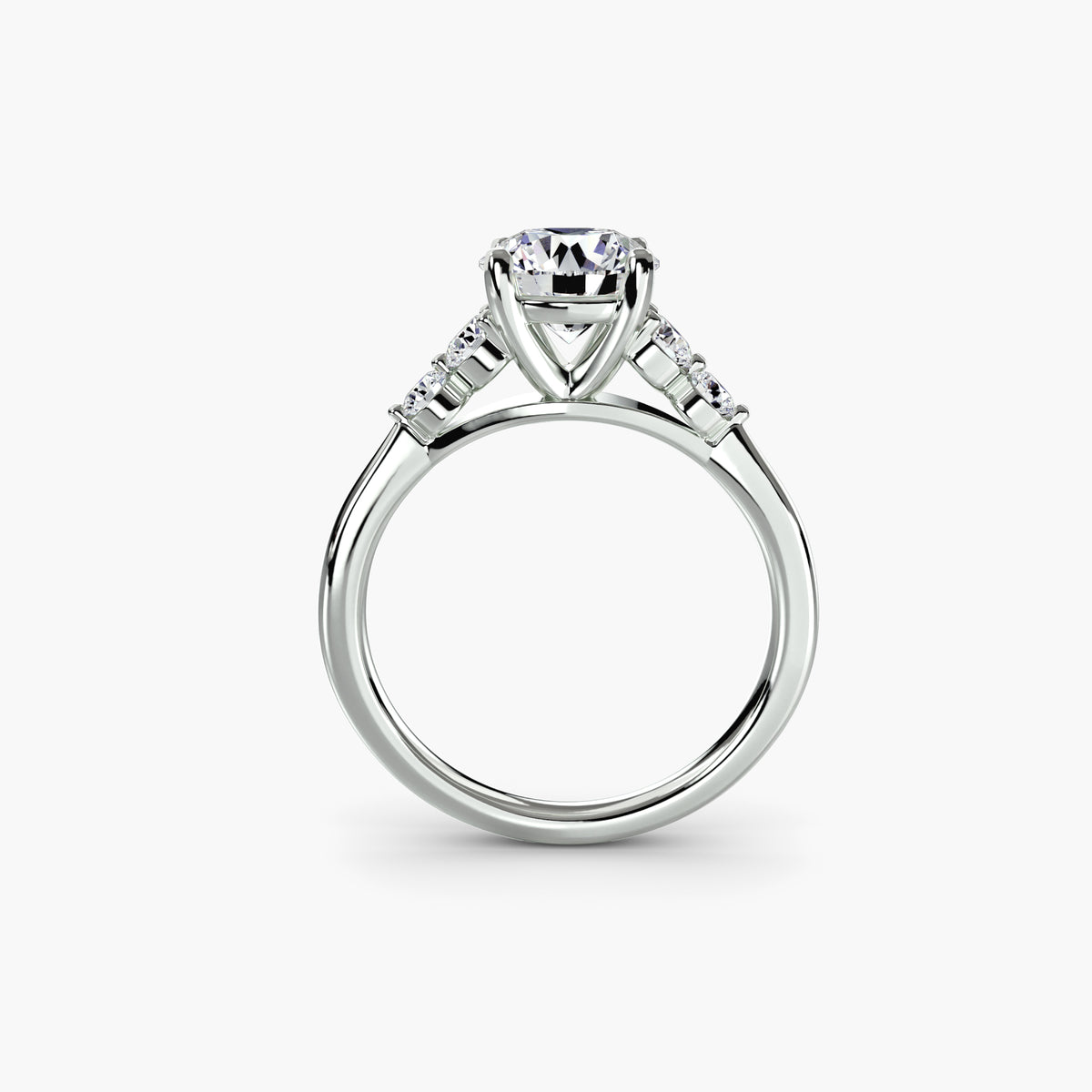 Profile view of The Sabine solitaire engagement ring with graduated diamond side stones